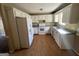 Efficient kitchen with white cabinets and laminate flooring at 270 Mountain Way, Covington, GA 30016