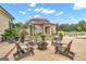 Spacious backyard patio with firepit and seating area, perfect for outdoor entertaining at 506 W Mcintosh Rd, Brooks, GA 30205