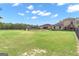 Spacious backyard with a large lawn, pool, and gazebo at 506 W Mcintosh Rd, Brooks, GA 30205