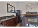 Basement bar with granite countertop and wooden cabinets at 506 W Mcintosh Rd, Brooks, GA 30205