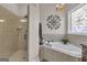 Spa-like bathroom with corner jacuzzi tub and walk-in shower at 506 W Mcintosh Rd, Brooks, GA 30205