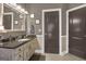 Bathroom with granite countertop, updated cabinets, and decorative mirror at 506 W Mcintosh Rd, Brooks, GA 30205