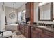 Bathroom with a large soaking tub and dark vanity at 506 W Mcintosh Rd, Brooks, GA 30205