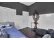 Bedroom with daybed, wood floors, and coat rack at 506 W Mcintosh Rd, Brooks, GA 30205