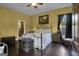 Bedroom with ensuite bathroom and dark hardwood floors at 506 W Mcintosh Rd, Brooks, GA 30205