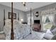 Charming bedroom with a post bed and sitting area at 506 W Mcintosh Rd, Brooks, GA 30205