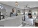 Spacious bedroom with a post bed, sitting area, and large windows at 506 W Mcintosh Rd, Brooks, GA 30205
