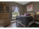 Bedroom with antique wood furniture, metal bed frame, and large window at 506 W Mcintosh Rd, Brooks, GA 30205