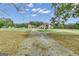 House with a long driveway and a large yard at 506 W Mcintosh Rd, Brooks, GA 30205