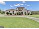 Grand two-story home with a large lawn and driveway at 506 W Mcintosh Rd, Brooks, GA 30205