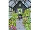 Greenhouse filled with various plants and flowers at 506 W Mcintosh Rd, Brooks, GA 30205