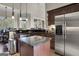 Updated kitchen with stainless steel appliances and an island at 506 W Mcintosh Rd, Brooks, GA 30205