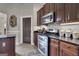 Modern kitchen with stainless steel appliances and granite countertops at 506 W Mcintosh Rd, Brooks, GA 30205