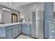 Modern kitchen featuring stainless steel appliances and blue cabinetry at 506 W Mcintosh Rd, Brooks, GA 30205