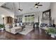 Relaxing living room featuring hardwood floors and a cozy sectional sofa at 506 W Mcintosh Rd, Brooks, GA 30205