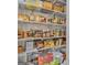 Well-stocked pantry with shelving for food storage at 506 W Mcintosh Rd, Brooks, GA 30205
