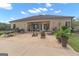 Large patio with seating and outdoor kitchen area at 506 W Mcintosh Rd, Brooks, GA 30205
