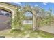 Ornate iron gate leading to a backyard pool area at 506 W Mcintosh Rd, Brooks, GA 30205