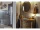 Elegant powder room with dark vanity and ornate mirror at 506 W Mcintosh Rd, Brooks, GA 30205