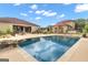 Large rectangular pool with stone coping and a waterfall feature at 506 W Mcintosh Rd, Brooks, GA 30205