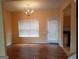 Bright dining room with hardwood floors and access to the backyard at 7777 Newbury Dr, Jonesboro, GA 30236