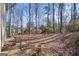 Spacious backyard with trees, patio furniture and wooded area at 1934 Hobson Sw Ct, Marietta, GA 30064