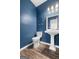 Small bathroom with pedestal sink and blue walls at 1934 Hobson Sw Ct, Marietta, GA 30064