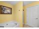 Bathroom featuring a corner bathtub and shower at 1934 Hobson Sw Ct, Marietta, GA 30064