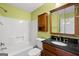 Bathroom with tub, vanity, and medicine cabinet at 1934 Hobson Sw Ct, Marietta, GA 30064