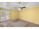 Bright bedroom with neutral walls, carpet, and ceiling fan at 1934 Hobson Sw Ct, Marietta, GA 30064