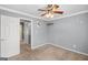 Bedroom with ceiling fan and access to hallway at 1934 Hobson Sw Ct, Marietta, GA 30064