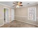 Bedroom with ceiling fan, carpet, and ample natural light at 1934 Hobson Sw Ct, Marietta, GA 30064