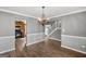 Bright dining room features hardwood floors and a chandelier at 1934 Hobson Sw Ct, Marietta, GA 30064