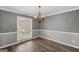 Spacious dining area with hardwood floors and large window at 1934 Hobson Sw Ct, Marietta, GA 30064