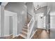 Two-story entryway with staircase and hardwood floors at 1934 Hobson Sw Ct, Marietta, GA 30064