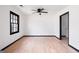 Bright bedroom with ceiling fan, new flooring, and a window at 1463 Rockmoor Ct, Stone Mountain, GA 30088