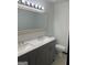 Bathroom with double vanity and updated fixtures at 7280 Oswego Trl, Riverdale, GA 30296