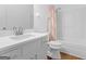 Clean bathroom with white vanity, shower/tub combo, and updated fixtures at 5893 Nell Ln, Ellenwood, GA 30294