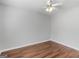 Simple bedroom with hardwood floors and ceiling fan at 5893 Nell Ln, Ellenwood, GA 30294