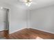 Spacious bedroom with hardwood floors and neutral walls at 5893 Nell Ln, Ellenwood, GA 30294