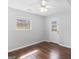 Bright bedroom with wood floors, a window, and exterior door at 5893 Nell Ln, Ellenwood, GA 30294