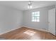 Bright bedroom featuring hardwood floors and ceiling fan at 5893 Nell Ln, Ellenwood, GA 30294