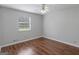 Spacious bedroom with hardwood floors and ceiling fan at 5893 Nell Ln, Ellenwood, GA 30294