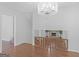 Bright dining room with hardwood floors and a view of the living room fireplace at 5893 Nell Ln, Ellenwood, GA 30294