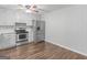 Bright kitchen boasts stainless steel appliances and hardwood floors at 5893 Nell Ln, Ellenwood, GA 30294