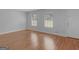 Living room with hardwood floors and neutral wall colors at 5893 Nell Ln, Ellenwood, GA 30294