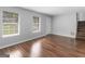 Bright living room with hardwood floors and neutral walls at 5893 Nell Ln, Ellenwood, GA 30294