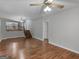 Spacious living room with hardwood floors and kitchen views at 5893 Nell Ln, Ellenwood, GA 30294