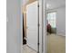 Doorway view into bedroom with window and desk area at 119 Bombay Ln, Grantville, GA 30220