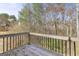 Wooden deck overlooking a wooded backyard at 119 Bombay Ln, Grantville, GA 30220